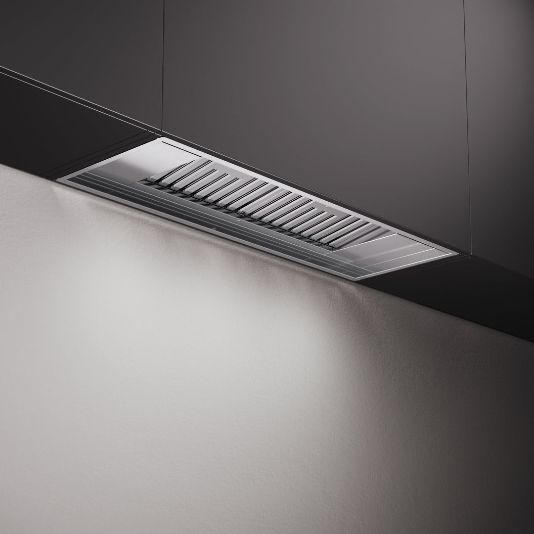 Integrated stainless steel canopy cooker hood with professional baffle grease filters for discreet kitchen extraction