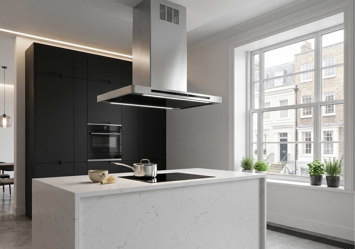 90cm Linea island cooker hood in stainless steel within a modern open plan kitchen diner. Featuring black cabinets, built in appliances and a white marble island.