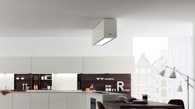 Tolvi Ceiling Cooker Hood With Stainless Steel Ceiling Mount. Installed Within a Sleek And Minimalistic White Kitchen