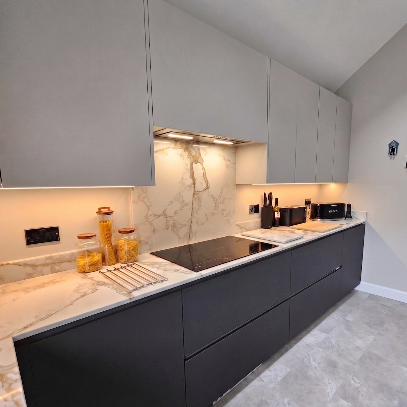 Luxair 72cm stainless steel canopy cooker hood with Dynamic LED lighting installed in a modern grey kitchen with marble backsplash