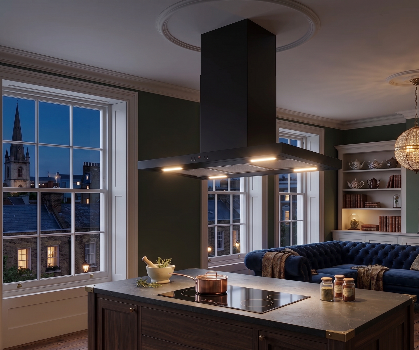 90cm Moda island cooker hood installed within a modern open plan kitchen diner. Featuring dark wooden elements and sage green walls
