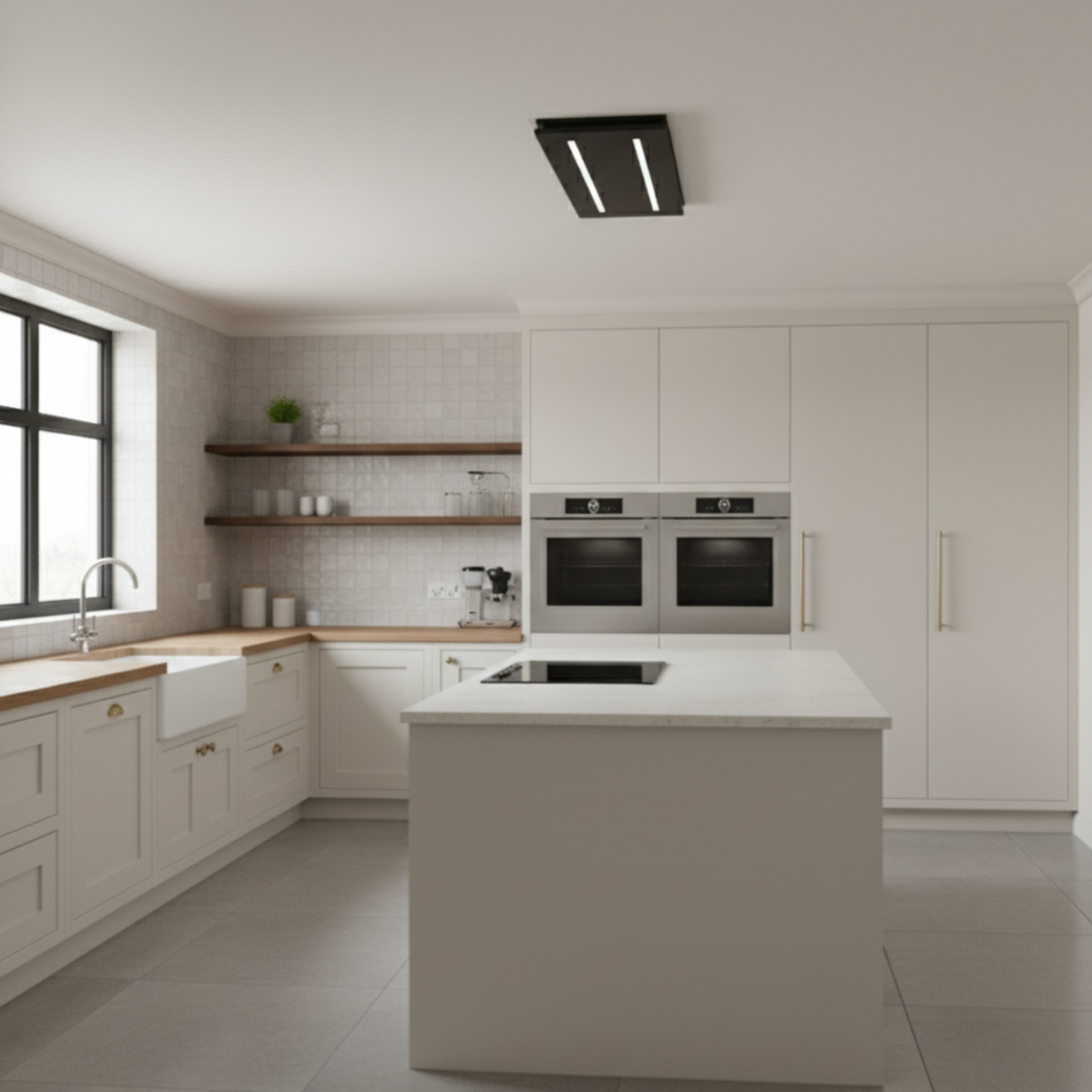 Modern white kitchen island with marble countertop featuring a black 800mm small ceiling extractor fan mounted flush above an induction hob