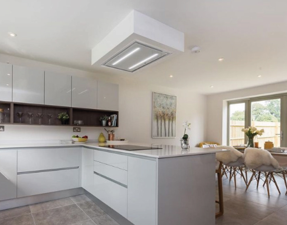 White 90cm Celux Cooker Hood Installed In A Sleep White Kitchen & Housed Within A Custom Dropped Box False Ceiling 