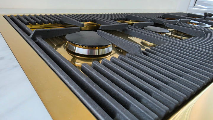 Milanello gas hob in gold with cat iron pan 