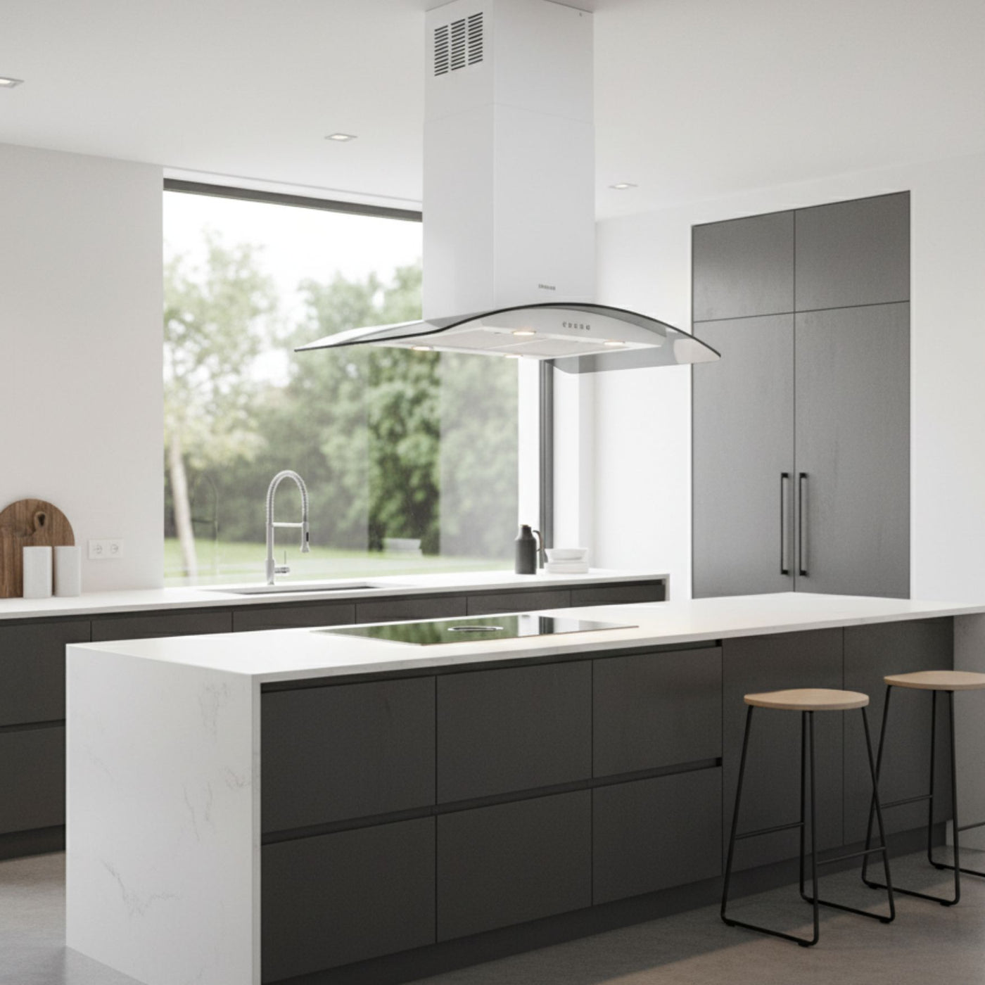 White curved glass island cooker hood within a sleek and minimalistic style kitchen