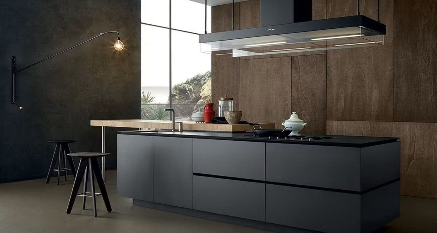 Black Diora Island Extractor Fan Installed In A Sleek, Modern, Dark Kitchen Above a Gas Hob