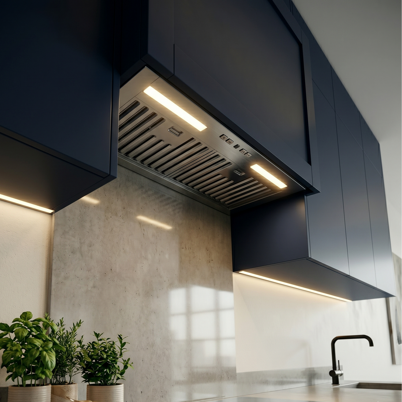 Close-up of a Luxair 60cm stainless steel canopy cooker hood with bright LED lighting installed in modern navy blue kitchen cabinets