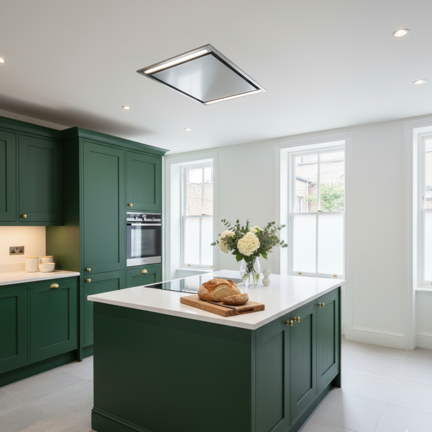 Stainless Steel Mille Ceiling Cooker Hood Within A Traditional Green and White Kitchen.