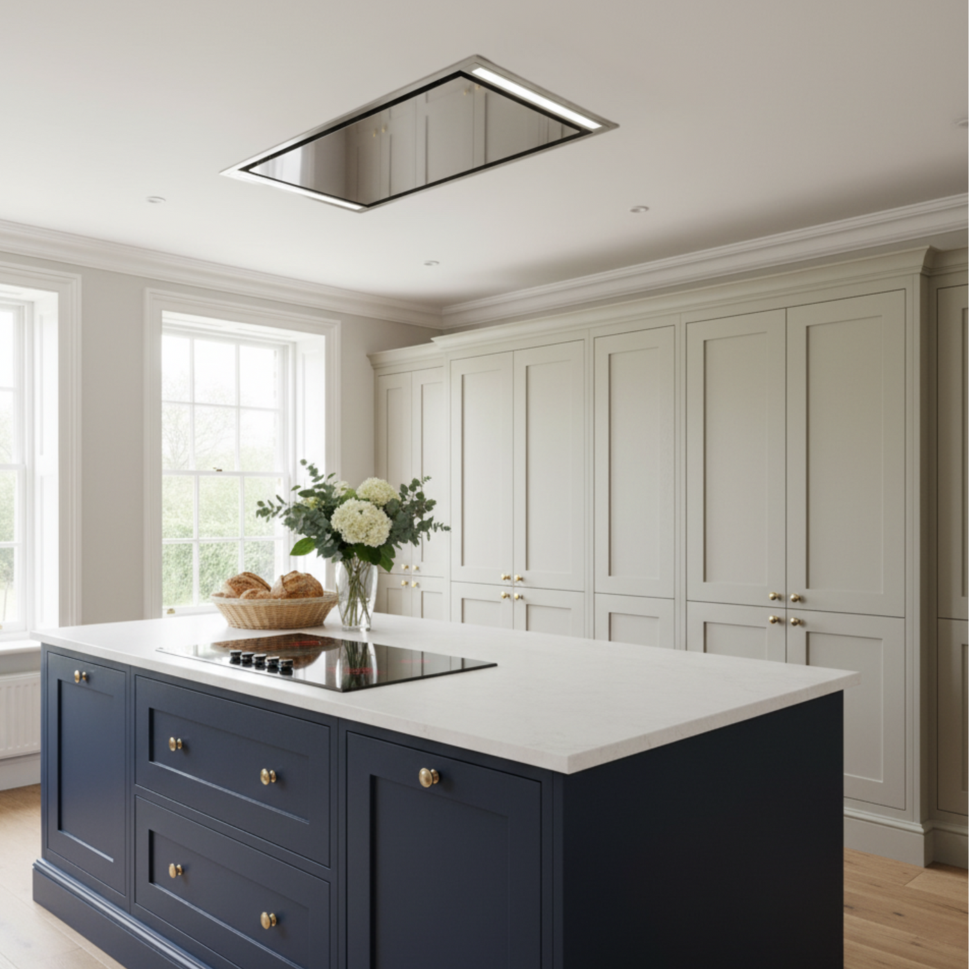 Mille Ceiling Cooker Hood Stainless Steel Installed In A Navy Blue and Beige Kitchen Featuring Antique Brass Elements