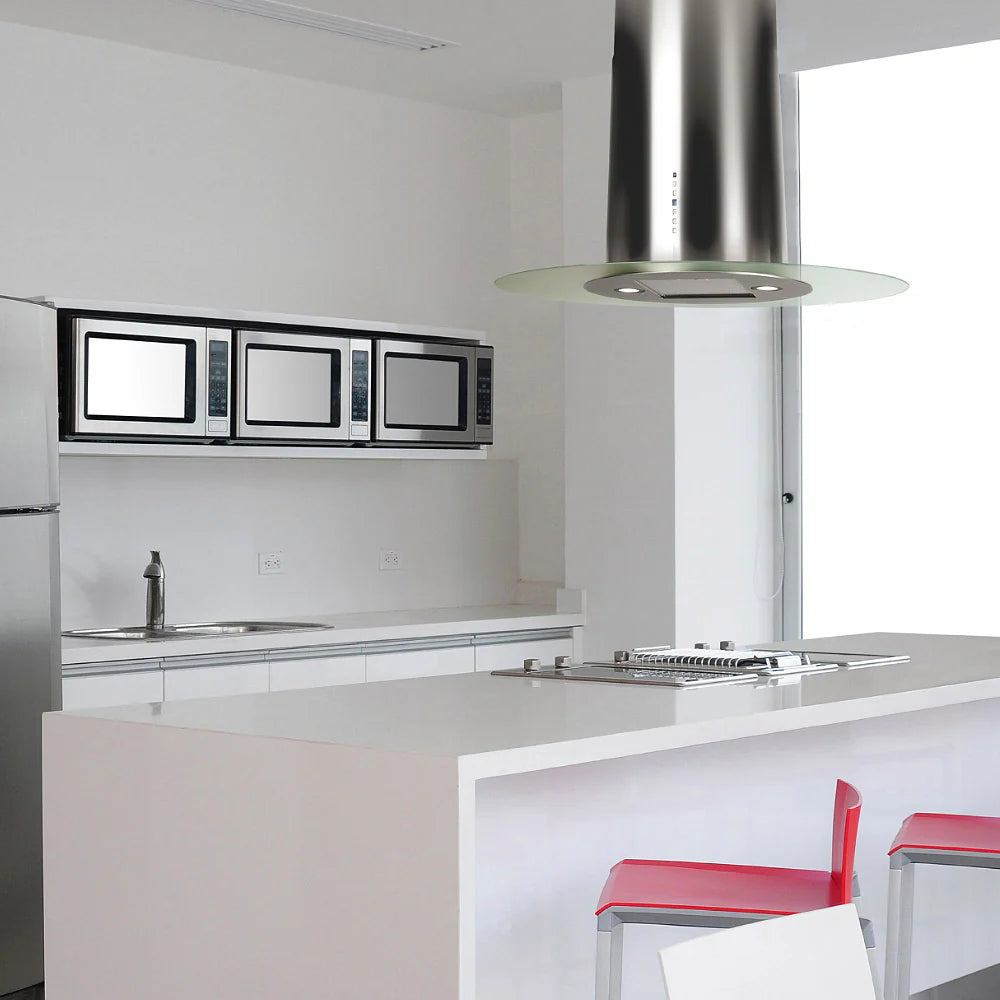 Oval island cooker hood installed within a sleek white kitchen featuring built in appliances 